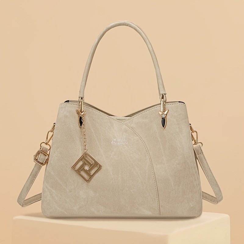 Borsa a spalla vintage da donna, caratterizzata da un'artigianalità